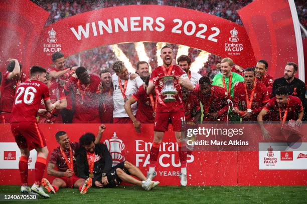 Jordan Henderson of Liverpool celebrates with the Emirates FA Cup trophy following his team's victory in The FA Cup Final match between Chelsea and...