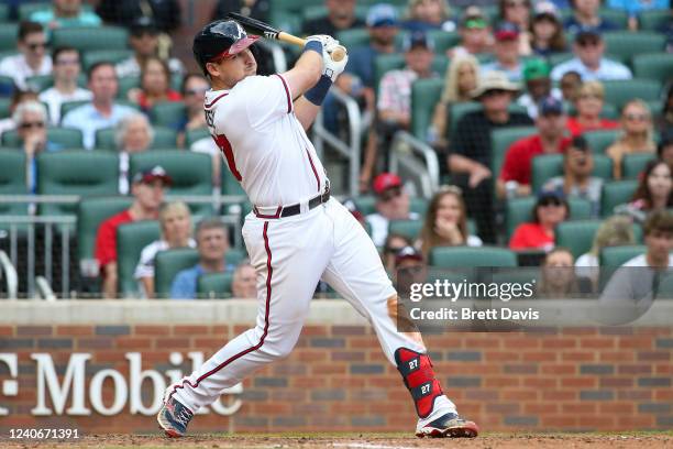 Austin Riley of the Atlanta Braves hits an RBI double in the eighth inning of a game against the San Diego Padres at Truist Park on May 14, 2022 in...