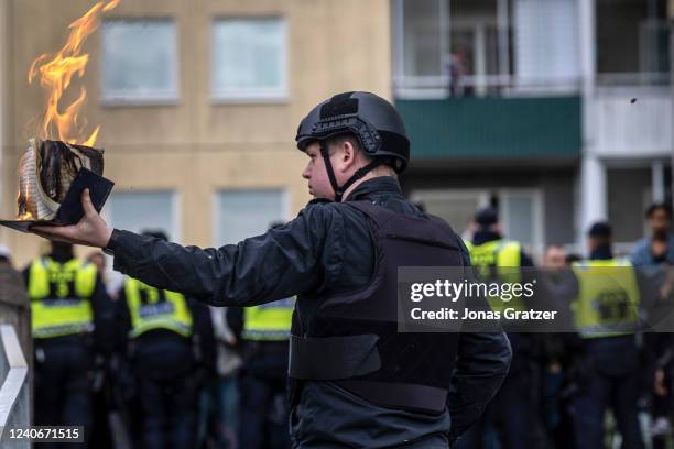 Rasmus Paludan burns a Koran during an election meeting in Husby on May 14, 2022 in Stockholm, Sweden. Far-right Danis-Swedish politican Rasmus...