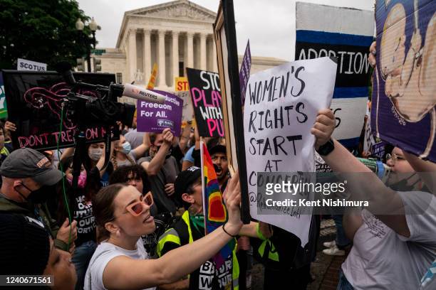 Abortion rights activistsand Anti-abortion activists shout at each other during a Bans Off Our Bodies rally and march to the Supreme Court of the...