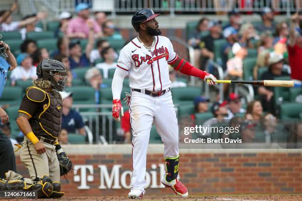 Marcell Ozuna of the Atlanta Braves hits a two-run home run in the eighth inning of a game against the San Diego Padres at Truist Park on May 14,...