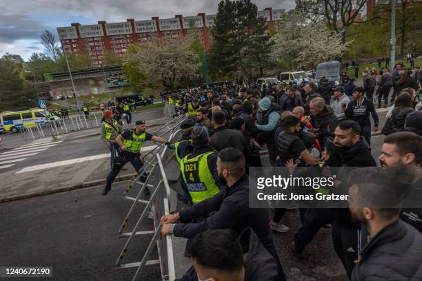Counter-protesters gather against the burning of a Koran in Hallunda on May 14, 2022 in Stockholm, Sweden. Far-right Danis-Swedish politican Rasmus...