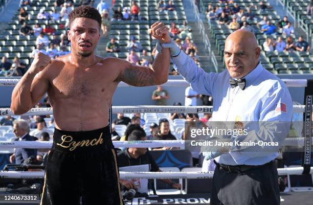 Referee Edward Hernandez lifts the arm of Brandyn Lynch after he defeated Marcos Hernandez in their light weight fight at Dignity Health Sports Park...