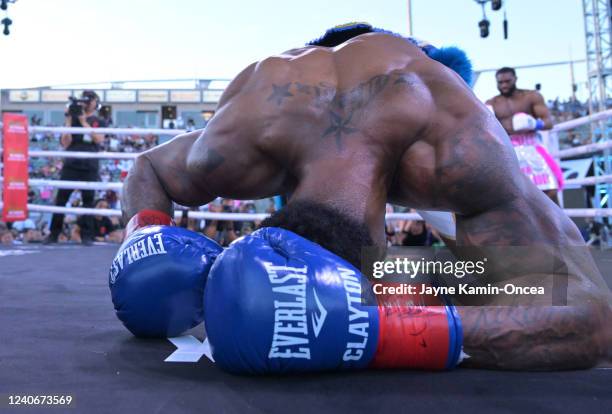 Jaron Ennis looks on as referee Ray Corona stops the fight after Custio Clayton was knocked out in the second round of their welterweight title fight...