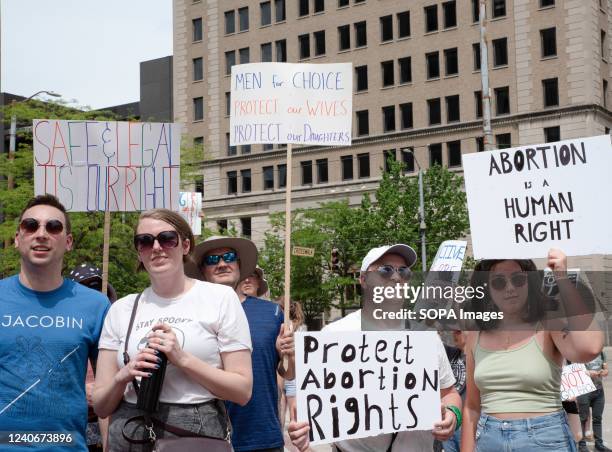 Protesters hold placards expressing their opinion at a pro abortion rights rally. People from many different cities gathered to support and rally for...