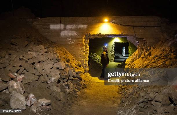 April 2022, North Rhine-Westphalia, Porta Westfalica: A man walks through a partially collapsed gallery in the Jakobsberg near Porta Westfalica. The...