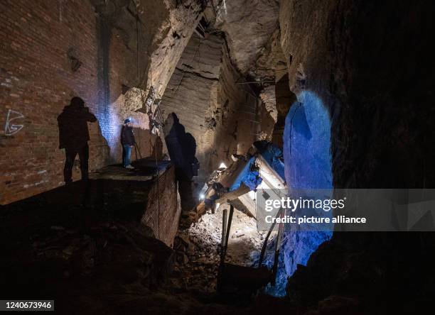 April 2022, North Rhine-Westphalia, Porta Westfalica: A man walks through a partially collapsed gallery in the Jakobsberg near Porta Westfalica. The...