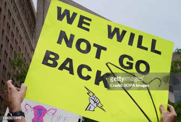 Protester holds a placard that says "We will not go back" at a pro abortion rights rally. People from many different cities gathered to support and...