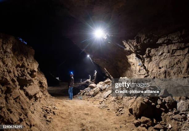 April 2022, North Rhine-Westphalia, Porta Westfalica: A man walks through a partially collapsed gallery in the Jakobsberg near Porta Westfalica. The...