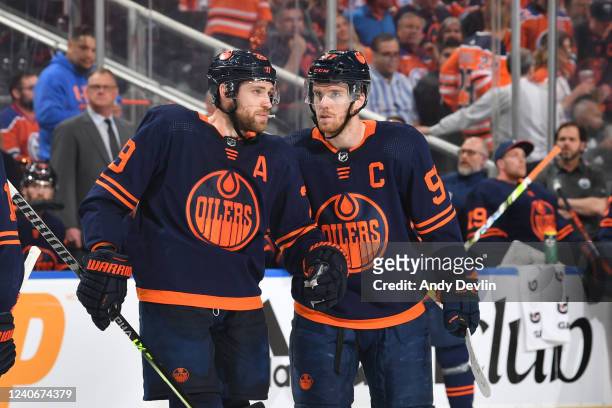 Connor McDavid and Leon Draisaitl of the Edmonton Oilers discuss the play during Game Seven of the First Round of the 2022 Stanley Cup Playoffs...