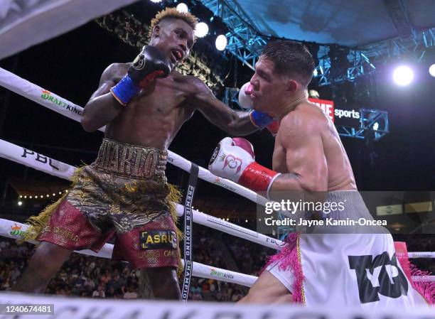 Jermell Charlo exchanges punches in the ring with Brian Castano during their super middleweight title fight at Dignity Health Sports Park on May 14,...