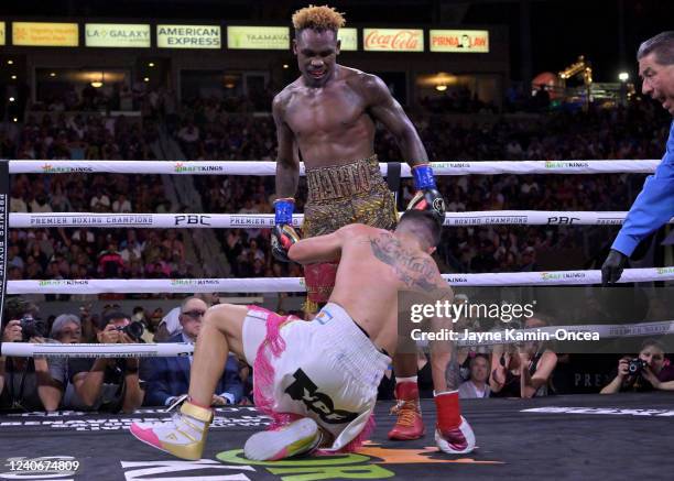 Jermell Charlo knocks down Brian Castano during their super middleweight title fight at Dignity Health Sports Park on May 14, 2022 in Carson,...