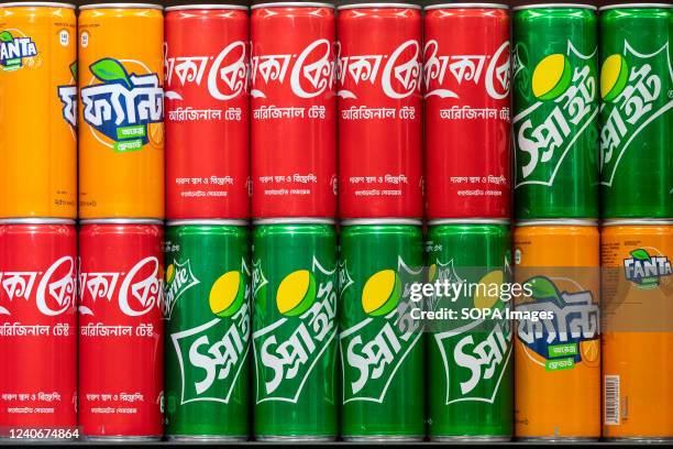 American soft drink brands, Coca-cola, Sprint, and Fanta, are seen for sale at a snack stall at the Dhaka international airport.