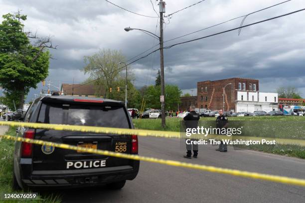 Police are posted on Riley Street after a shooter was taken into custody. The shooter fired on multiple people at the Tops Friendly Market on...