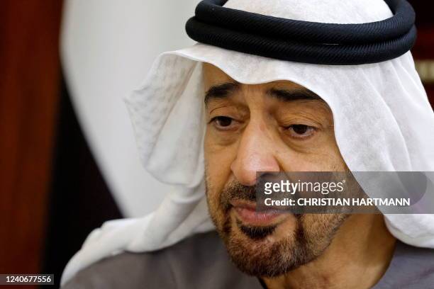 Newly-elected president of the United Arab Emirates Sheikh Mohammed bin Zayed Al Nahyan looks on during a meeting with French President at Al Mushrif...