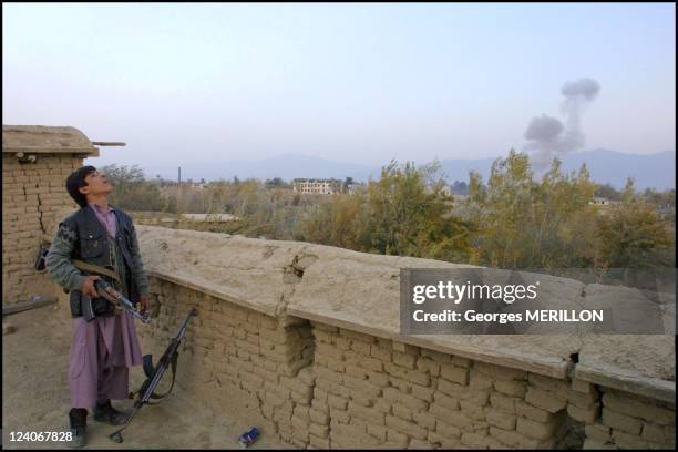 American Fighter Planes bomb Taliban Targets on front at Bagram Airport, 25 kilometers from Kabul, Afghanistan on October 21, 2001 - With soldiers of...