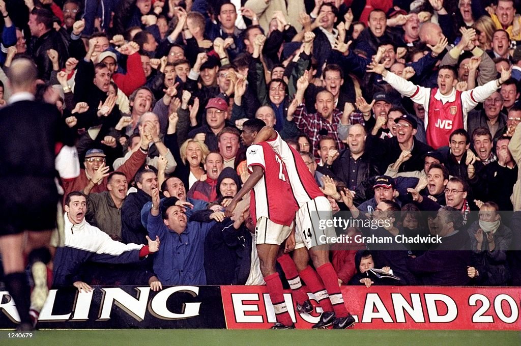 Nwankwo Kanu and Thierry Henry of Arsenal