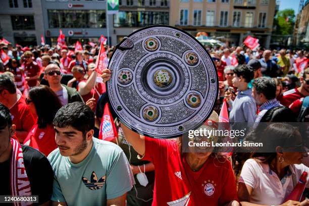 Bayern Muenchen fans celebrate at Marienplatz on May 15, 2022 in Munich, Germany. FC Bayern secured a 10th consecutive Bundesliga title.