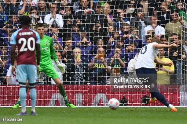 Tottenham Hotspur's English striker Harry Kane scores the opening goal from the penalty spot during the English Premier League football match between...