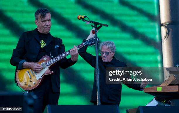 Pasadena, CA Devo members Mark Mothersbaugh, right, vocals, keyboards, and Bob Mothersbaugh guitar, vocals, perform at the Cruel World festival at...