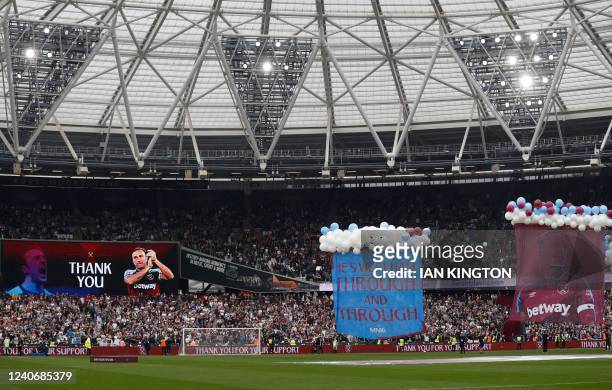 Banners and ballons are displayed in tribute of West Ham United's English midfielder Mark Noble for his last game at the end of the English Premier...