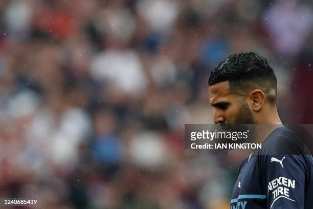 Manchester City's Algerian midfielder Riyad Mahrez reacts at the end of the English Premier League football match between West Ham United and...
