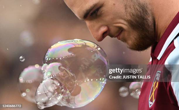 West Ham United's English midfielder Declan Rice reacts prior to the English Premier League football match between West Ham United and Manchester...