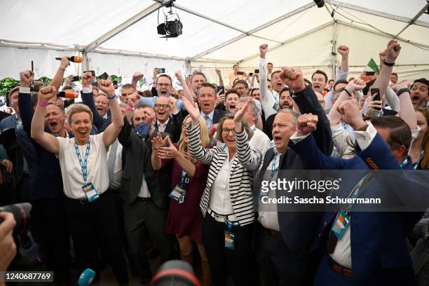 Supporters of the German Christian Democrats react following initial exit poll results in state elections in North Rhine-Westphalia on May 15, 2022...