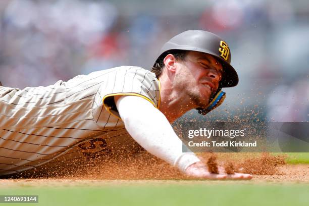 Wil Myers of the San Diego Padres slides into second during the seventh inning against the Atlanta Braves at Truist Park on May 15, 2022 in Atlanta,...
