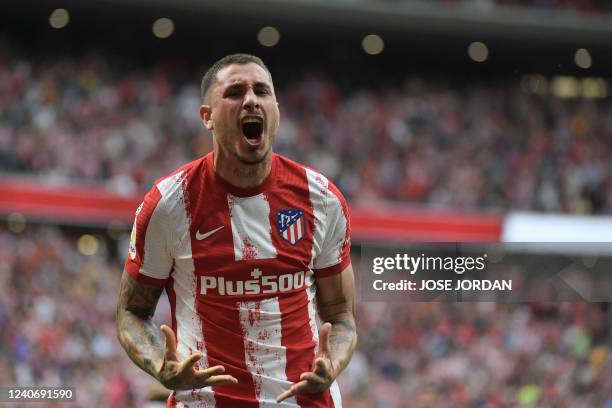 Atletico Madrid's Uruguayan defender Jose Gimenez celebrates scoring the opening gosl during the Spanish league football match between Club Atletico...