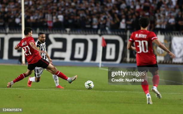 Ahly striker Taher Mohamed and Setif defender Houari Ferhani battle for the ball during the CAF Champions League semi-final match between Algeria's...