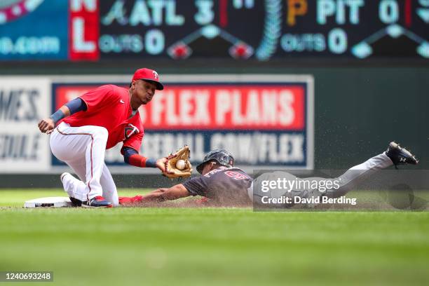 Richie Palacios of the Cleveland Guardians steals second base against Jorge Polanco of the Minnesota Twins in the second inning of the game at Target...