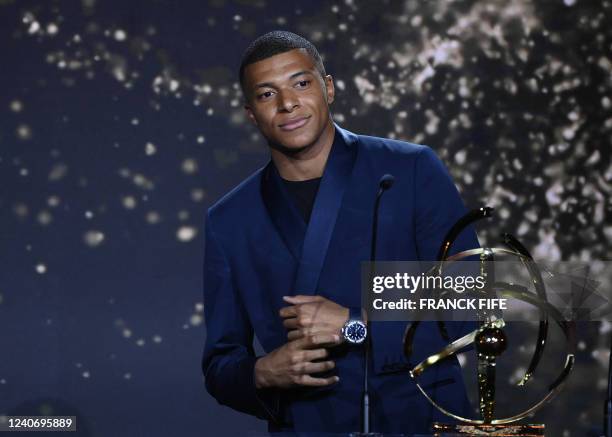 Paris Saint-Germain's French forward Kylian MBappe receives the Best Ligue 1 Player award during the TV show on May 15, 2022 in Paris, as part of the...