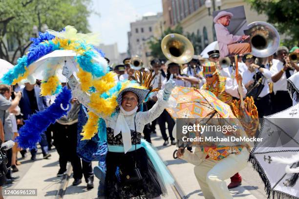 Second line honoring legendary jazz pianist and educator Ellis Marsalis Jr. Makes its way through downtown on May 15, 2022 in New Orleans, Louisiana....