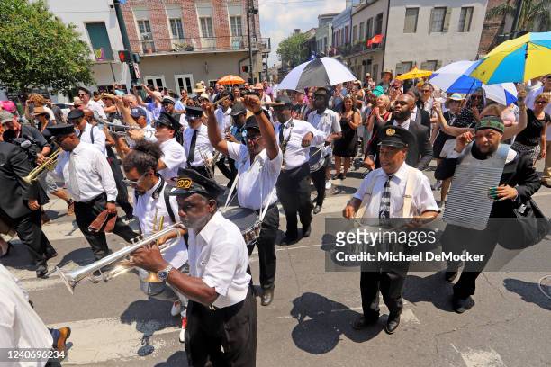 Second line honoring legendary jazz pianist and educator Ellis Marsalis Jr. Makes its way through downtown on May 15, 2022 in New Orleans, Louisiana....