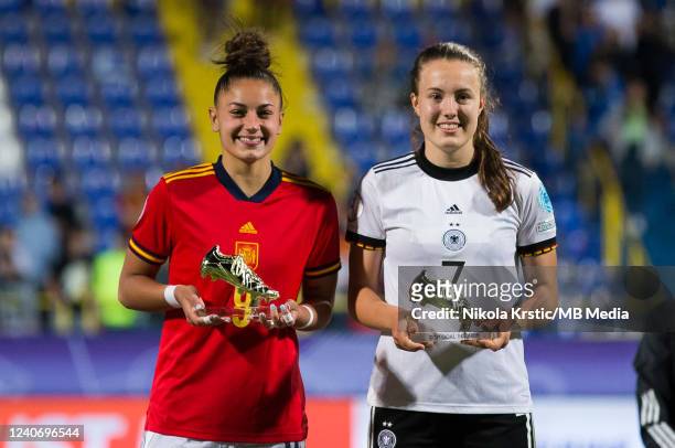 Mara Alber of Germany and Carla Camacho of Spain hold the trophy for the top scorer during the UEFA European Women's U17 Championship Final match...