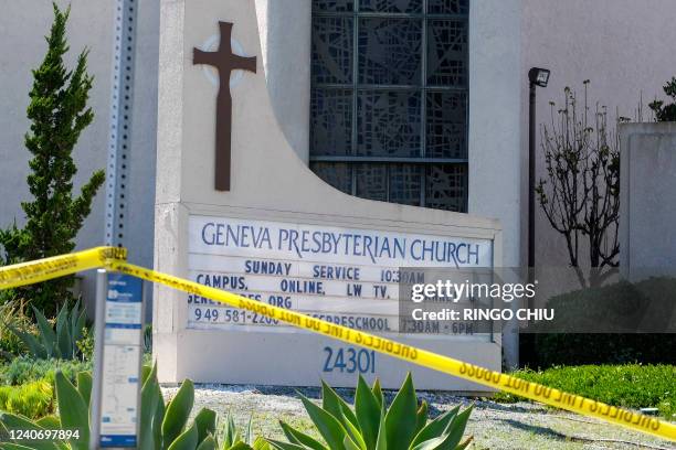 Police yellow tape is seen after a shooting inside Geneva Presbyterian Church in Laguna Woods, California, on May 15, 2022. - One person was dead and...