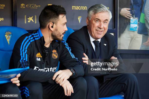 Carlo Ancelotti head coach of Real Madrid and Davide Ancelotti sitting on the bench during the LaLiga Santander match between Cadiz CF and Real...