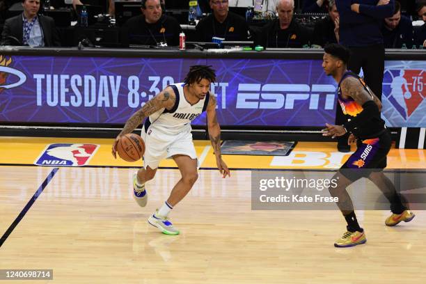 Elfrid Payton of the Phoenix Suns plays defense on Trey Burke of the Dallas Mavericks during Game 7 of the 2022 NBA Playoffs Western Conference...