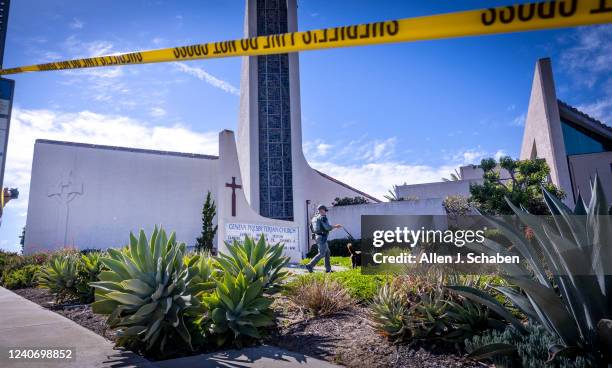 Laguna Woods, CA An Orange County Sheriffs Officer with a bomb-sniffing dog checks the exterior of the church after a person opened fire during a...