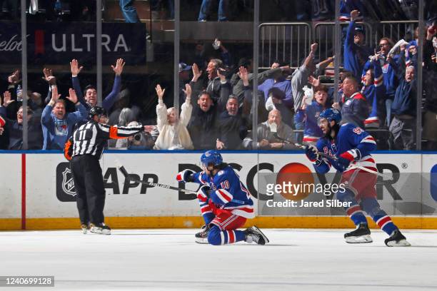 Artemi Panarin of the New York Rangers celebrates after scoring the overtime game-winning goal against the Pittsburgh Penguins in Game Seven of the...