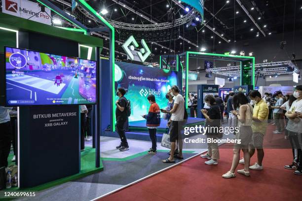 Attendees line up to try a VR experience at the BitKub booth at the Thailand Crypto Expo 2022 in Bangkok, Thailand, on Sunday, May 15, 2022. Thailand...