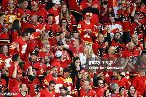 Ottawa Senators Left Wing Brady Tkachuk celebrates a goal by brother Calgary Flames Right Wing Matthew Tkachuk , not shown, during the second period...