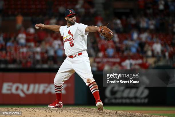 Albert Pujols of the St. Louis Cardinals pitches during the ninth inning against the San Francisco Giants at Busch Stadium on May 15, 2022 in St....