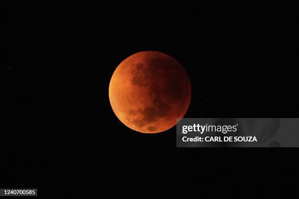 The blood moon is seen during a total lunar eclipse in Rio de Janeiro on May 16, 2022.