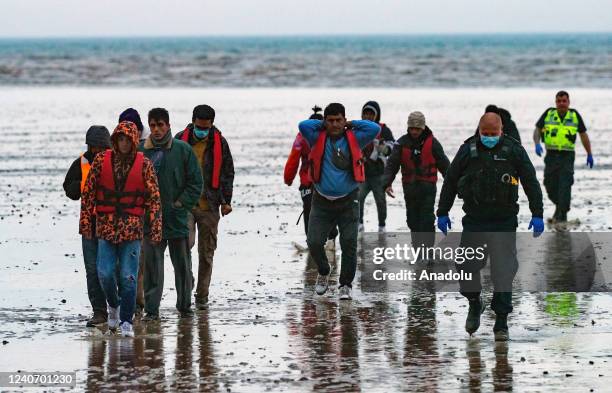 Dungeness RNLI lifeboat bring 45 Migrants ashore to Dungeness beach from 1 boat that they had picked up in the channel in bad weather conditions on...