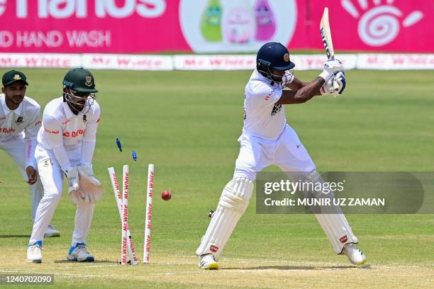 Sri Lanka's Ramesh Mendis is clean bowled off Bangladesh's Shakib Al Hasan during the second day of the first Test cricket match between Bangladesh...