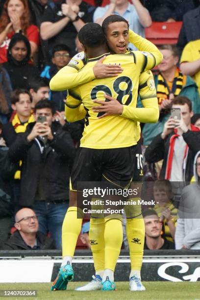 Watford's Joao Pedro celebrates scoring his side's first goal with team-mate Samuel Kalu during the Premier League match between Watford and...