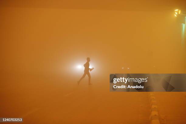 The streets are choked on yellow dust engulfing the city center as visibility in traffic degraded due to the sandstorm in Najaf, Iraq on May 15, 2022.