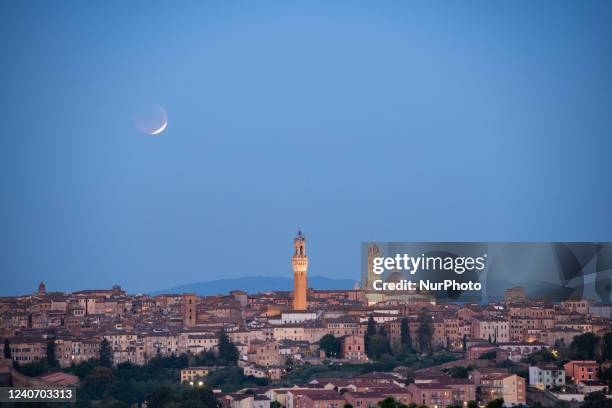 Moon eclipse is seen above Siena, Italy, on may 16, 2022.